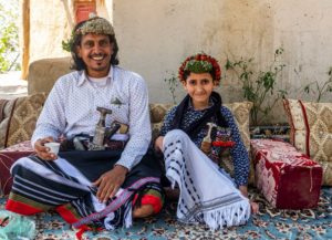 Traditional dressed man of the Qahtani Flower men tribe with a young boy, Asir Mountains, Kingdom of Saudi Arabia, Middle East